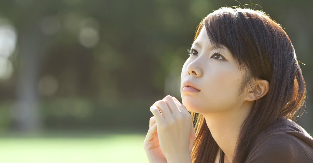 woman praying outside