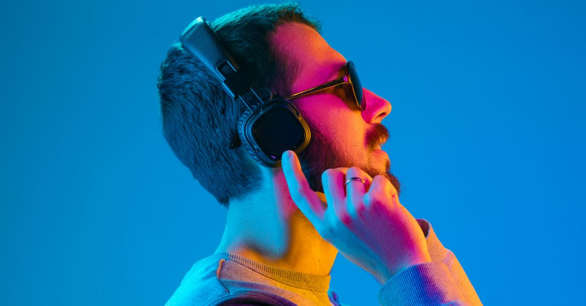 man listening to music on headphones