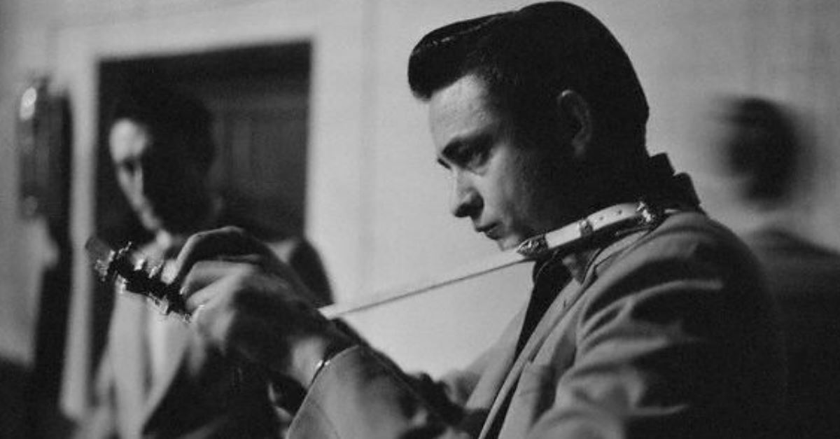 Johnny cash performing black and white photo