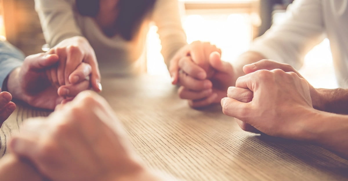 group holding hands praying, praying doesnt have to be hard