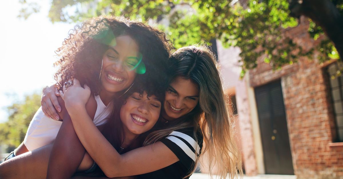 women friends hugging each other, what the world gets wrong about love