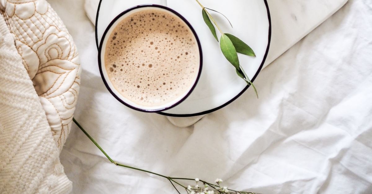 cup of coffee on bed sheets with flowers, what bible says about self care