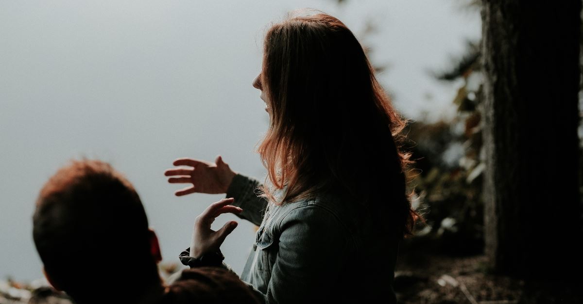 woman profile talking with hand gestures