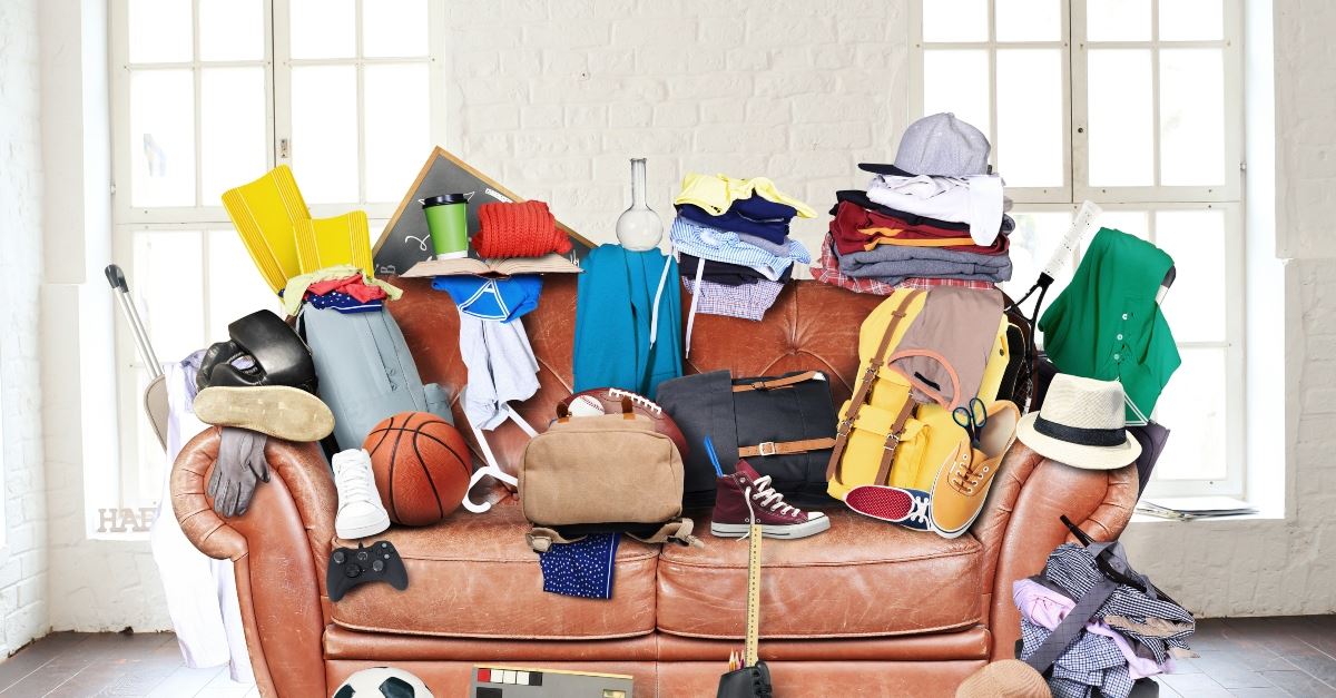 messy couch full of stuff, redefine organization