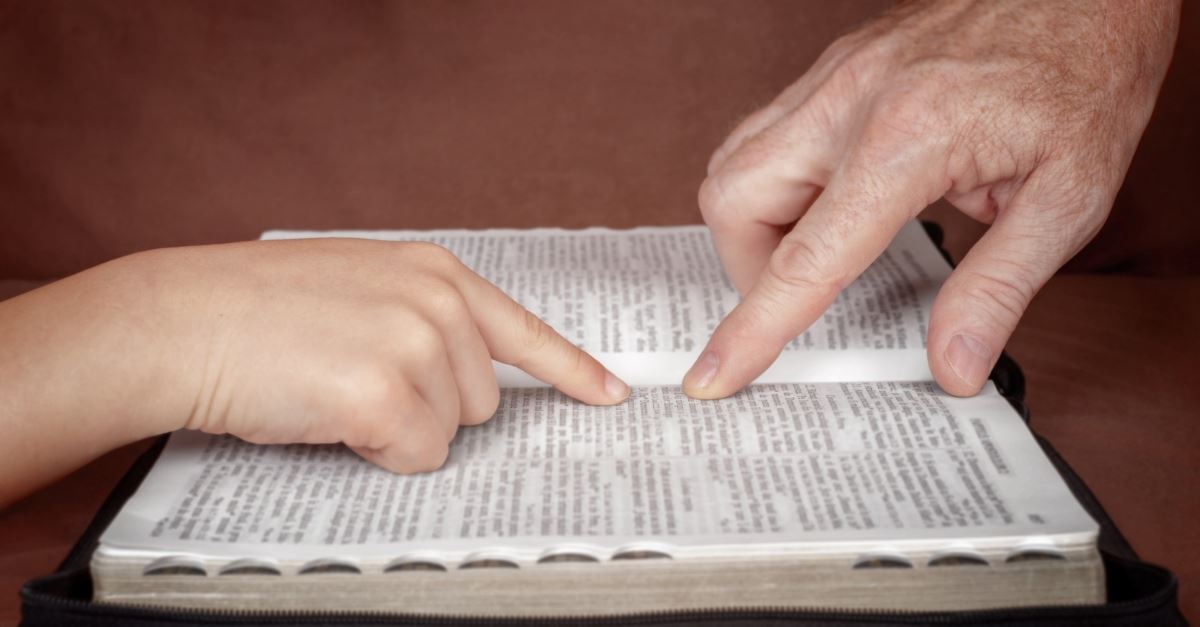 father and child reading the Bible together, things to teach your children about the Holy Spirit