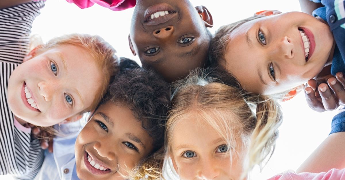 circle of smiling multiethnic diverse children