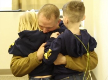 You can almost FEEL the anticipation as Lt. Shawn Mile nervously waits to surprise his two precious children, Carter and Paige.  God bless this wonderful family!  Such love.