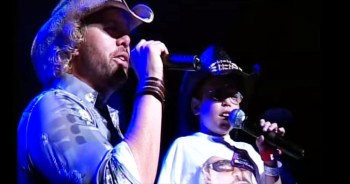 Toby Keith was in concert when he brought on stage a very special fan 10 year old Trevor Scott. Trevor had cancer and desperately wanted to sing 'American Soldier' with his favorite star. And the duet these two perform is enough to soften even the hardest heart. The best part, only 3 days after this amazing performance Trevor got the transplant that saved his life! God is so good!