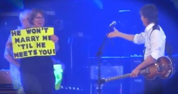 Paul McCartney sees a lot of signs in the crowd when he’s performing. But THIS particular sign caught his eye. And when he pulled this couple on stage, my heart was leaping with joy. What an amazing moment to remember!