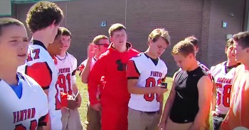 When this high school football team got to the field to practice they saw a lonely frightened little boy. They were confused but then they saw a strange man trying to kidnap the little boy. That's when these teenage boys stepped in and did something heroic. Good job boys! 