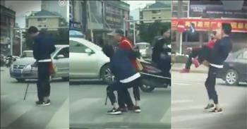 Young Man Drops Everything To Help Elderly Woman Cross Street