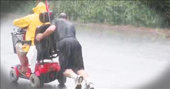 During this terrible thunder and lightning storm this man looked at his window to see a gentlemen stuck in the rain when his electric wheelchair stopped working. He went to put on his shoes but before he could finish he realized his neighbor had already come to the man's aid. Seeing this Good Samaritan push this stranger through the rain up a hill is truly enough to restore your faith in humanity!