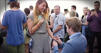 Sarah was visiting New York City with her mother and aunt when she turned around to see a surprising sight. Sarah's boyfriend, Brett, was in New York too and he'd planned this entire trip in order to propose. And when he gets down on one knee...so sweet!