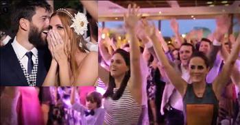 Mary and Ciao were up on the stage at their wedding when 'Love Never Felt So Good' started to play. The bride and groom were a bit confused at first, but quickly the guests started to dance in unison. As the song went on, all 400 guests joined in for the biggest wedding flash mob we've ever seen! Seeing the tears of joy in the bride's eyes truly shows what a special moment this was. What a fun wedding surprise!