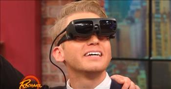 Gene and his young bride have recently welcomed their new son to the world, but Gene has never seen his wife nor his son's face in full.  Gene suffers from Stargardt's disease, which significantly blurs his vision to the point that his vision can't compose a complete picture of anything.  Watch this tender moment as he uses glasses featuring a newly developed technology to see not only his beautiful wife and baby, but also his parents.