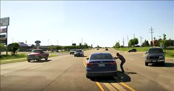 These police officers were driving down the highway when they noticed a car driving erratically. As they were pulling up, a total stranger jumped out of his own car and dove into the open passenger window of the out of control car. It turns out the driver was having a seizure and the brave stranger jumping into the car and putting it in park just may have saved this driver's life! The whole thing was caught on the police dashcam and I was praying the whole video through. God bless this hero!