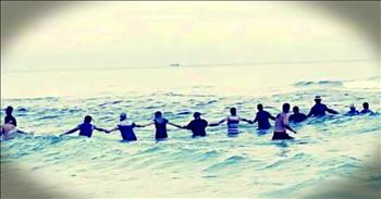 A frightening situation occurred when 10 people swimming along the shore got caught in a Rip Current in Panama Beach, Florida. There was no lifeguard on duty, so the situation could have ended very badly. 

Thankfully, about 80 beach-goers all joined together to help these strangers. They stood together and made a human chain in the ocean which kept everyone from getting swept away. After about an hour, everyone was able to come safely to shore. 

What an incredible story of ordinary people joining together to save lives. The kindness of humanity is incredible!
