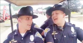These four Indiana state police officers were made famous last year when their Grease lip sync went viral.

 This year, they're at the Indiana State Fair and decided to have some fun.So they hopped on a golf cart and gave a hilarious impromptu sing-a-long to the famous hit 'The Boys Are Back In Town'. 

I love watching as they groove to the beat while cruising down the road. This video is already being seen all over the Internet and the officers are happy to put a smile on someone's face. This video had me giggling the whole way through. What a joyful memory!