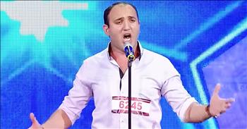 Opera singer Kakhaber Chumburidze has no problem impressing the judges on Georgia's Got Talent. From the second he started to sing, the entire crowd was in complete awe. 

I was definitely not expecting that big voice to come out of this man. And when he hit those high notes, I was cheering along with the audience. No wonder this guy earned that golden buzzer. 

This performance was one of the best I've ever seen and I can't wait to see what he does next. This is a well-deserved standing ovation.