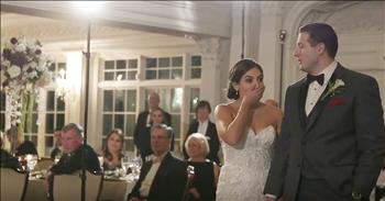 Charlie and Petrina had just gotten married and the whole family couldn't wait to celebrate with them at the reception. When it came time for the father of the bride to share a few words, he started his toast with a story of a stranger he met. 

This woman had just gotten married at the same place as Petrina and Charlie. Then, he asked her if there was anything she would change about her wedding and she said she had wished it could last just one day more. When these words were said, it triggered a big reaction from the crowd and a group of Petrina's theatre friends burst into a planned flash mob to the song 'One Day More' from the Broadway musical Les Miserable. 

There are truly some talented folks at this wedding. And watching the bride's face is absolutely priceless. This dad certainly pulled this one off. This is so fun!