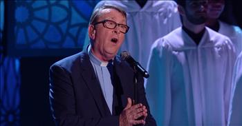 We first heard about Father Ray Kelly when a video of him singing at a wedding a few years ago <a href="https://www.godtube.com/watch/?v=WGWY7LNX" target="_blank">went viral</a>. 

Then, this talented priest decided to take his talents all the way to the Britain's Got Talent stage to perform R.E.M’s <a href="https://www.godtube.com/watch/?v=10M9CMNU" target="_blank">‘Everybody Hurts’ </a>. His audition struck a chord with everyone and he easily moved on to the next round. 

Now, this incredible singer is back for a soul-stirring rendition of 'Go Rest High On That Mountain.' From the very first note, I knew this was going to be another superstar performance. There's no doubt that Father Kelly has a God-given talent. 

This 64-year-old priest definitely has a voice and he's letting the whole world hear it. This priest brought the Lord to the stage and it's got me saying amen. What an incredible way to share the good news.