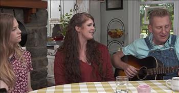 We all fell in love with the bittersweet love story of Joey and Rory Feek and their music. The two singers fell in love and became a popular duo on the country music scene. 

Sadly, in 2014, Joey was diagnosed with cervical cancer. After fighting an incredible battle for two years, this amazing woman went home to be with the Lord. Before her death, Joey left us with a number of beautiful music performances and videos of herself with her husband and daughter, Indiana. Though she may be gone from this earth, Joey is far from forgotten. 

Today, her husband Rory is returning to the musical stage to continue to share the gift of song. He's joined by his other two daughters, Heidi and Hope, at the kitchen table as he sings a special rendition of 'Someone You Used To Know.'

Rory Feek helped write this song with Tim Johnson in 1998. This tune was recorded by Collin Raye and hit #3 on the country charts. During this acoustic performance, his daughters join in and it's absolutely incredible. 

Rory has such an amazing story to share and he's always been open about his love, loss and recovery. I'm so glad that he's returning to his roots and honoring Joey's memory in the sweetest way. 