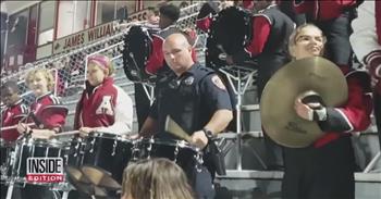 A police officer in Arkansas was working at a high school football game when a student said something that landed the officer up in the middle of the stands. The crowd was surprised to look up and see the man in uniform standing with a bunch of teens in band uniforms, while he jammed out on the drums!
 
Corporal Les Munn, an officer with the Texarkana Arkansas Police Department, shared that he was at the ballgame when students in the band started joking with him that he should carry their heavy drums up into the stands for them. He said, ‘ok,’ and once he got there they dared him to play with them. The officer, who actually used to be in his own high school band, hadn't played the drums in 23 years. But that didn't stop him from accepting  the students’ challenge! He grabbed the sticks and played with the marching band during the fourth quarter of the football game. 
 
The crowd couldn’t have been more surprised and delighted! Watch the video and see for yourself his impressive performance. He did so well, that the band director invited the officer to come back next year for a repeat performance. We wonder if he’ll be practicing up to surprise the football fans with something epic!
 
‘Class is out, but he still schooled them,’ the reporter for Inside Edition joked!
