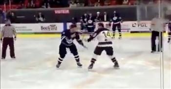 In a moment that has gone viral on the Internet, two rival hockey players dance instead of fighting. Ice hockey is known for being a rough sport loaded with physical contact. 

During games, it’s not uncommon for fights to break out or players to lose teeth from a rogue hockey puck. When in competition-mode, temperatures can run high and it’s easy for someone to lose their cool. The referees are always on high alert to break up any potential altercations. So, it wasn’t a crazy sight when two players from opposite teams looked like they were gearing up for a fight at a recent game. 

In this viral video, you can see the two players glare at each other before starting to circle each another on the ice. Their fists are in the air, as if they could take a swing at any moment. At least three referees can be seen closing in on the pair. Slowly, they start to get closer and just when I thought a brawl was going to break out, something completely different happened instead. 

The two men locked arms and started to glide around on the ice together. Just watch as they dance together on the rink to the surprise of everyone in the arena. You just cannot help but smile when you see these rivals put their team loyalties aside and give everyone a laugh. 

Now, this hilarious video is making the rounds all over social media. It’s been shared, viewed and liked thousands of times in just a few days. 