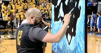 Artist and singer Joe Everson stunned the crowd at a basketball game when he performed The Star Spangled Banner while painting. I think we can all agree that The National Anthem is one of the hardest songs to perform. Those high notes at the end can be a challenge even for the most seasoned musician. But today, one man is sharing a unique rendition of this iconic song and it has the whole nation in awe. 

Joe Everson was tasked with singing The Star Spangled Banner before a Mississippi Tigers basketball game at Mizzou Arena. He started to belt out the lyrics that we all know and love. 

'O say can you see by the dawn's early light 
What so proudly we hailed at the twilight's last gleaming' 
Whose broad stripes and bright stars through the perilous fight 
O'er the ramparts we watched, were so gallantly streaming' 

But Joe wasn’t just singing, he was also painting at the same time. At first, the crowd wasn’t quite sure what he was drawing. You can see faces in the crowd looking intently at Joe and his creation. Right before the big finale, Joe flipped the canvas around and it revealed the symbolic image of raising the flag on Iwo Jima. The crowd ignited in cheers as Joe proudly added the stripes on the flag while simultaneously hitting that last note. 

What an incredible display of talent, artistry and patriotism. Joe certainly has a gift for performing and painting and I’m so glad that he’s sharing his skills with the world. Who else was in awe when he turned the painting over?
