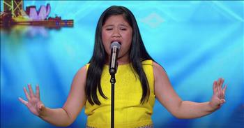 10-year-old Eleana Gabunada earned the coveted golden buzzer with her Barbra Streisand audition on Asia’s Got Talent. When this young talent took the stage, she brought everything that she had. As soon as she stepped up to the microphone, Eleana captivated the entire audience with her positive personality. And then she started to sing an awe-inspiring rendition of Barbra Streisand's 'Don't Rain On My Parade.’ 

“Don't tell me not to live 
Just sit and putter 
Life's candy and the sun's 
A ball of butter 
Don't bring around a cloud 
To rain on my parade”
 
This is a very difficult song to perform, especially for a young girl. There are so many high notes that it has a tendency to trip up even the most seasoned performers. But Eleana belted out the words in perfect fashion. This young girl may be small but she certainly possesses one big voice. And her performance definitely impressed the judges. She earned rave reviews for this entertaining performance. Judge David Foster was so impressed that he said, “There’s no doubt in my mind that if you want to be on Broadway one day, you will be.” And when it came time to vote, David decided that Eleana deserved more than just the usual ‘yes.’ He reached over the table and hit the golden buzzer sending this young talent right through to the next round. You can just see the look of joy and amazement on Eleana’s face as confetti flies down from the ceiling. I have a feeling that we will be hearing this name in the future.