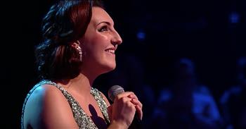Aimee, a part-time Disney princess, performs a stunning rendition of ‘Part Of Your World’ from The Little Mermaid on All Together Now. 

This BBC competition show features a panel of 100 judges from the United Kingdom who all have a musical background. The panel includes performers, producers, and other experts in the music industry. 

Once an artist starts performing, the 100 can turn their light on, stand up and sing along. The contestant with the highest amount of lights from that round will move on in the competition. As a part-time job, Aimee dresses up like various Disney princesses and attends parties for children. 

It’s an amazing job that offers her a lot of fulfillment, but Aimee dreams of striking out on her own. “What I want to achieve from being on All Together Now is recognition. People don’t see the person behind the wigs and costume.” 

Just watch as she steps on stage with no costume or persona to hide behind. She confidently belts out the lyrics to the Disney classic, ‘Part Of Your World.’ 

“Up where they walk
Up where they run
Up where they stay all day in the sun
Wanderin' free
Wish I could be
Part of that world”

Aimee’s performance earned her a total score of 51, putting her in first place for this round. There’s no doubt that she made a name for herself and Aimee definitely has the talent to be a real contender in this competition. What a beautiful performance of this beloved classic.