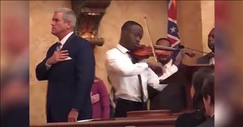 A young man stuns the crowd when he performs ‘The Star Spangled Banner’ on violin before before the Mississippi State Capitol. 

In 1814, Francis Scott Key penned the iconic song during The War Of 1812. British forces bombed Fort McHenry, but the U.S. proved victorious during the battle. The next morning, Francis Scott Key spotted the American flag flying over the fort and he was immediately inspired. 

In 1931, The United States Of America officially adopted ‘The Star-Spangled Banner’ as our anthem.

“O! say can you see by the dawn's early light, 
What so proudly we hailed at the twilight's last gleaming, 
Whose broad stripes and bright stars through the perilous fight, 
O'er the ramparts we watched, were so gallantly streaming? 
And the rockets' red glare, the bombs bursting in air, 
Gave proof through the night that our flag was still there; 
O! say does that star-spangled banner yet wave 
O'er the land of the free and the home of the brave?” 

Today, John Uzodinma is getting his own chance to perform this patriotic tune and it’s absolutely stunning. This University Of Southern Mississippi graduate easily earned a standing ovation for his beautiful rendition. 

The National Anthem is never an easy song to sing or perform, but John showed no nerves as everyone around him saluted the flag. 

After one of the state representatives posted the video online, John’s performance went viral. In fact, it’s been video almost 6 million times across social media. That’s one patriotic display that no one will soon forget. 