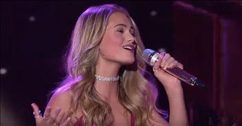 American Idol contestant Riley Thompson sings an upbeat rendition of the Alan Jackson song, ‘It Must Be Love.’ 

This 16-year-old country singer impressed the judges right from the start. Her first audition was an original song titled ‘Oh Daddy’ and it won her a ticket straight to Hollywood. 

This teen showed maturity and poise throughout the entire process. Now, Riley is fighting for her spot in the Top 10 of the competition. After learning that viewers did not vote her through, Riley was given the chance to sing for the judges and live audience. 

At the end of all the second-chance performances, the judges will be able to save one contestant from elimination. Even though her confidence was slightly rattled, Riley walked out on stage and sung her heart out to the iconic Alan Jackson song, ‘It Must Be Love.’ 

“It must be love it must be love
I fall like a sparrow and fly like a dove
You must be the dream I've been dreamin' of
Oh what a feelin' it must be love”

Riley completely engaged the crowd with her unique country voice and the judges were thrilled with her song selection. After the performance, Luke Bryan said, “I love the song choice. It embodies what you've given us throughout this competition.” 

Even though Riley ultimately did not continue on to the next round, she was given many words of hope and praise for the judges. 

At just 16 years old, Riley has accomplished things that many only dream of. I definitely think this talented teen has a long career in entertainment ahead of her. 