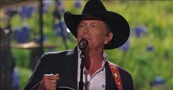 Country superstar George Strait performs his single ‘God And Country Music’ live at the 54th ACM Awards. 

There’s something about country music and the gospel that fit together so perfectly. Nothing can compare to hearing an uplifting Christian song with a bluegrass backdrop. 

Legendary country performer George Strait certainly agrees with this sentiment. The words of his latest song, from the album ‘Honky Tonk Time Machine,” remind us of the unique connection. 

“God and country music,
They both showed you the truth
Seen the low of the valley
And the highs of the mountains too
Folded hands and guitar strings
Jukebox preachers and angels singing
Call you like they knew ya
Between the hell and hallelujah”

Today, George is performing this powerful single at the 54th Academy Of Country Music Awards show. With a guitar in his hand, this country icon belts out the words as members of the audience nod their head in agreement. 

“God and country music are like whiskey and a prayer 
Like Johnny Cash's arm around Billy Graham 
God and country music 
They both never change 
You find 'em when you need 'em 
Where you stand”

George Strait is one of the most beloved country artists of all-time. Time after time, his songs resonate with fans all over the world. 

‘God And Country Music’ premiered during one of his ‘Strait to Vegas’ residency shows and, since that moment, people have rallied around the anthem. Everyone is in agreement, just like George sings, “there's two things still worth saving, God and country music.”