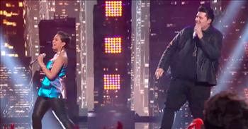In a recent episode of American Idol, Alyssa Raghu and Wade Cote performed a duet of the song “Ain’t No Mountain High Enough” by Marvin Gaye and Tammi Terrell.
 
Both of the performers look like they are having so much fun up on stage singing and dancing together. Their energy is infectious! Alyssa is hitting those powerful belts with her soulful voice, and Wade is mixing up the song with his unique, raspy voice. The two seem like an unlikely vocal pairing, but they both make it work and put on a great show!
 
Alyssa Raghu is a 17-year-old from Orlando, FL. She was actually on American Idol last season and made it to the Top 24 contestants. This year she wanted to try again to see if she could do better. In school, she shines in musical theater and other musical chorus programs. Her counterpart on stage, Wade Cote, is 27 years old and is from Phoenix, AZ. He has spent most of his musical life performing in bands.
 
In this video of the performance, it is just so entertaining to watch Alyssa and Wade up on stage together! The audience is clearly loving them as they clap and dance along while watching them belt out such a classic song. The judges Katy Perry, Luke Bryan, and Lionel Richie are loving the pair as well. All three of them have nothing but praise to give Alyssa and Wade.
 
“The two of you together, believe it or not you were having fun, we got that,” says Lionel Richie. “And keep that up, because that’s what makes show business, show business!”
 
In this episode, the Top 8 contestants left on American Idol were paired up to perform iconic movie duets. Some of the other songs performed were “A Million Dream” from The Greatest Showman and “Jackson” from Walk the Line.
 
We’ll be sure to keep up to date on American Idol news to see which talented contestant from the Top 8 become this season’s winner!