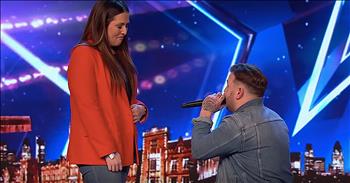 Britain’s Got Talent contestant surprises girlfriend with a proposal on stage after his impressive audition. 27-year-old Jacob Jones is a barber, but his real passion is music. 

Unbeknownst to Jacob, his girlfriend, Faye, filled out the application for him to be a part of the talent competition. He finally made it to the big stage and now he’s going to give it his all with a unique rendition of ‘You Are So Beautiful.’  

“You are so beautiful
To me
You are so beautiful
To me
Can't you see
You're everything I hoped for
You're everything I need
You are so beautiful
To me”

Halfway through the song, judge Simon Cowell stopped the performance. He asked Jacob to tone down his vocals and really let his nature voice shine through. The music queued back up and Jacob gave it another shot. And that rendition really struck a chord with the judges. 

After the performance, each judge raved about his sound and gave him a ‘yes’ to move on to the next round. But the best was still yet to come. Before Jacob exited the stage, he addressed the judges and audience. “I just wanted to do one thing before I came today. If I got four ‘yeses’ there was another ‘yes’ that I wanted to get.” 

That’s when Jacob invited Faye up on stage for a moment that she will never forget. The crowd was going wild as he got down on one kneel for this unexpected proposal. And, of course, she said yes!
