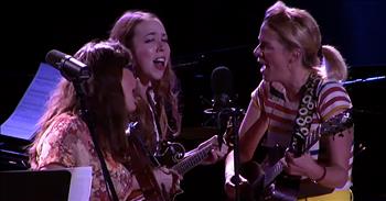 The talented trio of I’m With Her perform a bluegrass medley of classic hits on Live From Here. 

These three singer-songwriters have been touring the world for years, sharing their unique sound and performance. Their website describes the group performing saying, “Since forming in 2014, Sara Watkins, Sarah Jarosz, and Aoife O’Donovan have imbued their songs with a sharply detailed lyricism, graceful musicianship, and—perhaps most powerfully—mesmerizing harmonies that endlessly reflect their extraordinary chemistry.” 

Today, I’m With Her is at Live From Here for an incredible performance the bluegrass hits ‘Toy Heart,’ ‘Marry Me,’ and ‘Don’t You Hear Jerusalem Moan?’ The women start off singing completely a cappella and the sound flows all through the theater. 

“You played with my poor heart like a toy
That toy broke and then we had to part
It never can be mended 
I hope this romance's ended
Darling, you toyed with a toy heart”

After the first verse, I’m With Her pick up their instruments and start to play along. These bluegrass songs are a favorite by many and it’s so incredible to hear them played in such a unique way. By the time the women reach the final song in their mashup, the crowd was already totally invested. 

“Don't you hear Jerusalem moan?
Don't you hear Jerusalem moan?
Thank God there's a heaven and a ringing in my soul and my soul's got free
Don't you hear Jerusalem moan?”

I easily could’ve listened to 5 more songs from this talented trio. Who else is hoping to hear more from I’m With Her in the future?
