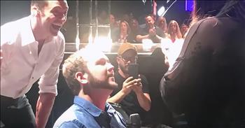 Hollywood actor and performer, Hugh Jackman, recently made one couple’s night when he aided in their proposal story. 

Hugh rose to fame with his role as Wolverine in the X-Men films. Since that time, he’s gone on to enjoy a favorable career performing in front of the cameras and on Broadway. 

In 2017, The Greatest Showman was released starring Hugh and Michelle Williams. The award-winning movie told the story behind P.T. Barnum and how this showman created the Barnum & Bailey Circus. The music featured in the film because an instant classic, spurning numerous covers and praise. 

Today, Hugh has taken his performance on the road with a worldwide tour titled, “The Man. The Music. The Show.” Combining stage performance, music numbers and detailed backdrops, this show is two and half hours of upbeat entertainment. But one stop in St. Paul, Minnesota is making headlines for a very special reason. 

In this clip, you can see Hugh step off the stage and make his way to a man in the crowd. He says, “I don’t normally do this and you’ll understand why afterward but I got a letter from a guy named Joe.”

That’s when he hands his microphone over to Joe Kripal. Before the concert, Joe wrote to Hugh telling him that he would be in the audience for this particular show. 

The young man wanted to propose to his girlfriend, Sanaa Ahmed and needed the Hollywood actor’s help. Hugh was more than happy to stop his concert for this special event and it’s sure to be a moment that this couple never forgets. 
