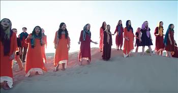 The Rise Up Children’s Choir performs a breathtaking cover of ‘Speechless’ from Aladdin. 

In 2019, Walt Disney released a live-action remake of the beloved animated film. Like any Disney movie, this one is packed with big names, such as Will Smith as The Genie. 

The songs that made this movie so popular were also updated and the entire production was full of elaborate set pieces and dazzling scenery. The film also featured a brand new song from Naomi Scott who portrayed Jasmine in the movie. ‘Speechless’ is a powerful ballad all about speaking up and not being silenced.

“But I can't cry
And I can't start to crumble
Whenever they try
To shut me or cut me down
I can't stay silent
Though they wanna keep me quiet
And I tremble when they try it
All I know is I won't go speechless”

Today, the talented voices of the Rise Up Children’s Choir are covering this special song. The choir is open to kids age 6 through 18 and they perform songs from every genre of music. 

On their website, the mission statement is described. “Every child is born with talents and passions. Rise Up Children’s Choir is a place where young performers are encouraged to pursue their passions and celebrate life through creative expression and personal discovery, both as members of the choir and in their daily lives.” 

Set to a jaw-dropping backdrop, this rendition of ‘Speechless’ will truly leave you in awe. It’s so amazing to see so many young vocalists come together and combine their incredible voices for this performance. 
