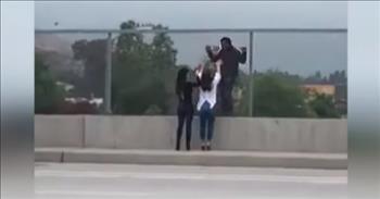Two women saved a man’s life who was ready to jump off of an overpass into busy freeway traffic in Los Angeles. They were on their way to dinner with their husbands, but when they saw the man looking like he was about to jump, they knew they needed to step in and help.
 
The women, Toni Musso and Jen Principe, called 911, but before rescuers got there, they took it into their own hands to save the troubled man.
 
“I just begged him, ‘Please don’t do this,’” said Toni. “The first thing I said was ‘We love you. Please don’t jump,’” explains Jen.
 
When the women approached the man on the overpass, he was standing outside the fence with the rushing freeway traffic below him. The only thing between them was the thin fence, and they knew that they had to somehow help him walk off the overpass, away from harm.
 
“I just grabbed his hands; I had his hands through here,” shared Toni as she was pointing to the overpass fence. “And then slowly, I just said, ‘Keep looking at me, keep focused on my eyes.’ And I just started walking with him slowly back to safety.”
 
Once the police got there, they let the women continue what they were doing without interruption. Toni and Jen knew that they were connecting with the man and helping him to safety, so they asked the police to not intervene. The police gave them the space they needed to work.
 
Jen says that the reason why she was so inclined to help this man was because of a story on CNN that she just watched two days prior. It was about a man, Kevin Hynes, who survived jumping off the Golden Gate bridge in 2000. His story reminded her how important it is to step in when you see something off.
 
“Had I not heard Kevin’s story, I probably would have driven under the bridge, called 911, and went about my business,” explains Jen.
 
Thank goodness that Jen and Toni did step in! Because of their actions, they were able to save a man’s life, show him that he is loved, and encourage him to not give up hope.
