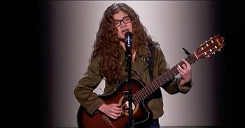 15-year-old Sophie Pecora returns to the America’s Got Talent stage with another original song that leaves us in awe. When we first met this talented young girl, she blew us away with her song, ‘7th Grade.’ 

Sophie always dreamed of singing on the big stage, but nerves kept stopping her from pursuing her dreams. With encouragement from her family, Sophie decided to audition for America’s Got Talent. 

She shared with the judges that she experienced many instances of bullying or alienation. This feeling inspired her to write the audition song. Sophie’s audition combined singing with rapping, all while she plays the guitar too. It was an emotional song that earned her four ‘yes’ votes from the judges. 

Now, she’s back for the live shows with another original song that is resonating with the entire arena. ‘Misfits’ is about feeling like you don’t quite fit in with the crowd. Sophie has always been shy and quiet, but slowly, she’s gaining the confidence to come out of her shell and be herself. 

After this incredible performance, Sophie earned rave reviews from the judges. Gabrielle Union said, “There’s nothing better than an artist that knows themselves and is very clear about their truth. And the way you expressed yourself, you just reached into our hearts and just snatched it right out.”

 But it was guest judge Brad Paisley who really connected with Sophie. 

After hearing her performance, he felt like he knew her. In fact, Brad was so moved by the song that he pressed his golden buzzer automatically sending Sophie on to the next round. What a talented young girl. 