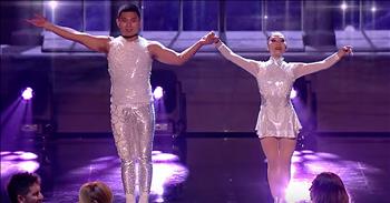 Husband and wife Gao and Lio leave the crowd stunned after their acrobatic audition on Britain’s Got Talent: The Champions. 

We first met this talented couple when the appeared on the first season of Asia’s Got Talent. Their emotional ballet audition earned the golden buzzer from judge Mel C and the duo went on to win the entire competition. Then, in 2017, Gao and Lio appeared on Britain’s Got Talent, making it all the way to the semi-finals. 

Now, they’re back on the big stage as they compete in Britain’s Got Talent: The Champions. This special format features 45 competitors from all of the Got Talent franchises. For six weeks, these all-stars will battle it out to see who will be crowned the ultimate champion. 

The list of contenders includes past winners, finalists and fan-favorites. With a talent pool like this, competitors must bring their very best. Gao and Liu did not disappoint with an emotional acrobatic routine that combined ballet and aerial skill. Not only is Liu extremely graceful, but she performs the majority of her moves while on top of her partner. 

These moves are very challenging on solid ground and this duo just added to the difficulty by leaps and bounds. Gao and Liu truly gave this performance their all and it showed. The emotion from their dance resonates all throughout the theater and it culminates in a truly unforgettable routine. 

What a beautiful display of talent and grace all in one. Who else was in awe of this breathtaking number?