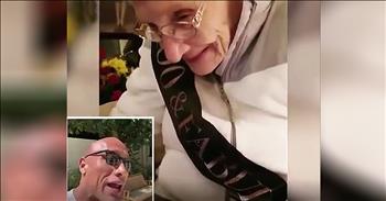 It was the surprise of a lifetime when The Rock sings Happy Birthday to this grandma on her 100th birthday. 

Normally, when we think of Dwayne ‘The Rock’ Johnson, we picture the super tough action movie star. But off-screen, this talented actor has a much softer side. 

Dwayne started off as a wrestler for the WWE, but as the years went on, he made the transition to a successful movie career. Some of his blockbuster hits include Disney’s Moana, The Scorpion King and The Fast and Furious films. 

Grandma Marie Grover has been following The Rock’s career for decades and is one of his biggest fans. As her 100th birthday approached, Marie’s wanted to pull out all the stops. That’s when she enlisted the help of her publicist friend to try and contact The Rock for a special birthday message. 

After a posting on Twitter, Dwayne personally responded writing, “What?? First I’m hearing of this! Who’s turning 100? Beautiful age! What do you need, Jamie?” That’s when this kind-hearted celebrity recorded a video of himself singing Happy Birthday to Marie with some heartfelt words at the end. When Marie saw the video, she was overcome with excitement. A huge smile spreads across her face as she listens to The Rock wish her well. “I’m sending you so much love and huge congratulations on 100 years. What an amazing life.” 

Once the video was posted online, it quickly went viral. Now, the whole world is sharing in the joy of Marie and her once-in-a-lifetime gift. 