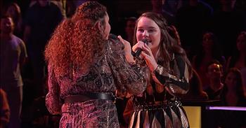 The Voice contestants Josie Jones and Kat Hammock perform a unique duet of ‘Take Me Home, Country Roads.’ 

This classic song was written by John Denver back in 1971. It became an instant hit for Denver. The entire tune is an ode to the great state of West Virginia. 

“Almost heaven, West Virginia 
Blue Ridge Mountains, Shenandoah River 
Life is old there, older than the trees 
Younger than the mountains, blowing like a breeze”

Today, two younger contestants on The Voice are taking on this nostalgic tune. 16-year-old Josie Jones and 18-year-old Kat Hammock are both members of Team Blake. 

After nailing their blind auditions, the teens were paired together for a singing duel in the battle rounds. With help from advisor Darius Rucker, both girls were tasked with putting their own touch on the classic song ‘Take Me Home, Country Roads.’  

“Country roads, take me home 
To the place I belong 
West Virginia, mountain mama 
Take me home, country roads” 

Almost everyone knows these nostalgic lyrics. Nowadays, our world seems to always be in a hurry. The words paint a picture of a simpler time where back roads and Mama’s homemade dishes were all we needed. It’s definitely a treat to hear these two young women belt out these iconic lyrics. 

Even though they come from different styles, this classic country tune seems to be the perfect compliment to their unique vocals. After Josie and Kat received rave reviews, coach Blake Shelton ultimately chose Kat to continue on in the competition. 
