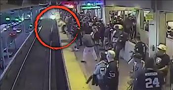 It was truly a heart stopping moment captured on camera when a transit worker saves a passenger that falls onto the train tracks. 

Everything changed from calm to panic in a matter of seconds for this train commuter. While waiting for the oncoming train, this passenger accidentally walked past the yellow line. 

As he lost his balance, he fell right onto the tracks. Thankfully, a worker was nearby and he was able to quickly reach down and pull the passenger to safety. 

All of this happened so fast that everyone was in shock. The security video reveals the terrifying moment as the oncoming train barrels down the tracks. The train was literally seconds from running over the passenger before he was pulled up. 

The footage will have you on the edge of your seat as you watch this frantic worker effortlessly lift the man. His quick thinking truly saved the stranger’s life and that is a gift that can never be repaid. 

Other commuters hardly had time to react before the entire situation was already over with. I know that this passenger was so thankful for the worker standing right beside him at that moment. 

In the hustle and bustle of daily life, we can often forget the everyday dangers that surround us. This powerful video serves as a reminder to always be aware of your environmental surroundings and to thank God for putting people in the right place at the right time. 

Who else was holding their breath the entire time?