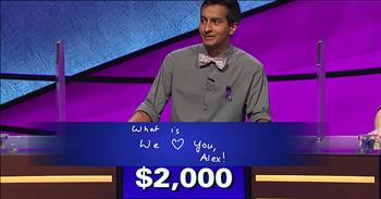 Beloved Jeopardy host Alex Trebek chokes back the tears during a touching interaction with a contestant.  

In March of 2019, fan-favorite television personality Alex Trebek announced to the world that he had been diagnosed with Stage 4 pancreatic cancer. Despite the grim prognosis, he pledged to continue hosting Jeopardy and mustering up all of his strength to defeat the cancer. 

Since that time, the 79-year-old has inspired the world with his honestly in the face of a tough situation and unrelenting perseverance. As he tackles his second round of chemotherapy, hosting Jeopardy becomes harder and harder. But Alex still has not missed a day of work. 

Recently, the annual Tournament Of Champions brought together the biggest winners from the past season. That’s where contestant Dhruv Gaur took the opportunity to show his support for the amazing host. 

During Final Jeopardy, instead of writing an answer, Dhruv wrote "What is we love you Alex!" His response resulted in a loss of $1,995 but the impact on the host and crowd was priceless. Alex was visibly touched by the gesture and seemed to choke up on his words. "That's very kind of you, thank you." 

In the clip, you can also spot Dhruv wearing a purple ribbon to promote awareness of pancreatic cancer. The incredible moment quickly went viral online with many viewers shedding tears for this timeless game show host. 

Alex is in all of our thoughts and prayers during this time. We wish him strength and peace as he continues his battle. 