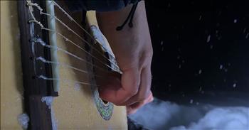 Hear ‘The Sound Of Silence’ like never before as one man performs the incredible song in a blizzard. 

Simon & Garfunkel originally released this iconic song in 1964. Since that time, many artists have lent their voices to the tune. One of the most well known covers came from the rock band, Disturbed, in 2015. 

Then, famed a cappella group Pentatonix released their own version and it skyrocketed the song back into popularity.

“Hello darkness, my old friend 
I've come to talk with you again 
Because a vision softly creeping 
Left its seeds while I was sleeping 
And the vision that was planted in my brain 
Still remains 
Within the sound of silence” 

AcousticTrench is a popular musician on YouTube. For years, this artist has been posting talented guitar covers of our favorite songs. 

Today, AcousticTrench is taking on ‘The Sound Of Silence’ during the middle of a blizzard. On the video description, they expanded on the moment. “Filmed in the middle of a blizzard. 
There's a beautiful silence at night when it snows and I felt inspired to record this song.” 

Using fingerstyle, this incredible guitarist gives this iconic song an entirely new feel. With the snow falling all around, it creates the most amazing backdrop for this chilling song. And I’m not the only one to feel this way. 

Since it was posted, the video has been viewed over 3 million times across social media. This is definitely one rendition of ‘The Sound Of Silence’ that you don’t want to miss. 
