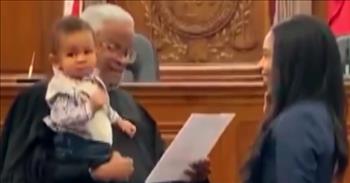 In this video, a caring judge helps calm a fussy baby while his mother was given the oath of admission in a Tennessee court room.
 
1-year-old Beckham Lamar was able to see his mother, Juliana, take her very last step before becoming a lawyer.
 
“To have my son right there witnessing his mom take the oath with him standing right there helping swearing me in, it was amazing,” Juliana says. “It’s probably a moment I will never forget.”
 
While Beckham was starting to get a little fussy during the procedure, like babies can do, the judge stepped in to help alleviate the situation.
 
“He went and grabbed Beckham and said ‘Ok, I want you to help me with this,’” Juliana explained.
 
The tender moment was captured by one of Juliana’s law school friends, and she shared it to social media. The video shows the end result of many days and nights of hard work and determination.
 
“It was amazing. This was a moment I’ve dreamed of for a very long time,” shares Juliana. “During my pregnancy, I didn’t know how I was going to get to this end goal. I didn’t know the path way, I didn’t know how I was going to do it. But that moment was everything coming together.”
 
Juliana Lamar is now working as a law clerk and hopes to one day become a sports and entertainment or corporate lawyer. She encourages everyone to stick with their dreams, even when the road becomes difficult.
 
“God placed you in that position for a reason,” she shares. “Don’t give up on yourself. There will definitely be nights that you’re crying, that you’re questioning yourself, you don’t know if you can do it, you feel guilty, you’re wondering if you’re making too many sacrifices. You’re going to have a moment just like I had, swearing in, when you just know that it was all worth it.”
