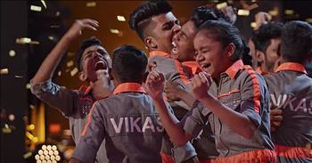 The V Unbeatable dance crew returns to the America’s Got Talent stage with an awe-inspiring routine. 

We first met this dance group during the 2019 season of AGT. Most of the members come from the slums of Mumbai. In these areas, there is no electricity and the conditions are very dirty. 

Many times there are seven or more people in one area that is meant for barely two. The chance to appear on America’s Got Talent was a dream come true. It gave these dancers the opportunity to create a better life for themselves and their family. 

Even though they did not win their season, the crew achieved worldwide fame appearing in Las Vegas shows and touring India. There is even a movie being made about their journey. 

Today, V Unbeatable is back on the stage that started it all as contestants on America’s Got Talent: The Champions. This special format of competition features over 40 acts from all across the globe. 

The list of contenders includes past winners, finalists and fan-favorites from the entire Got Talent franchise. “We are here to finish what we started and we want to win more than anything.” 

After a gravity-defying performance, the audience was on their feet cheering. And the thrills didn’t stop there. Each judge gave V Unbeatable a glowing review, with Simon Cowell even saying, “I think this has probably been one of the best acts we’ve seen in Champions this year.” 

But it was judge Howie Mandel that received the biggest cheers when he reached over and pressed his golden buzzer sending V Beatable straight through to the finals. 

Who is ready for their next performance?