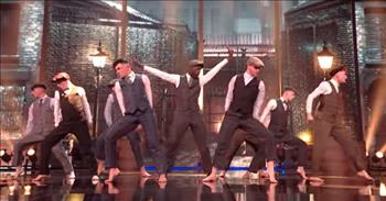 In this contemporary dance routine, a group called Brothers of Dance take us back in time with their performance.
 
The group is dancing on a show called The Greatest Dancer which is on BBC 1 and hosted by Alesha Dixon and Jordan Banjo. The judges on the show are Cheryl, Matthew Morrison, Oti Mabuse, and Todrick Hall and they are searching for the greatest dancer in the UK.
 
As the men in Brothers of Dance take the stage, they look dapper in their costumes inspired by the Peaky Blinders. The Peaky Blinders were a street gang in England at the end of the 19th century and after World War I. Members of the Peaky Blinders wore a signature outfit that included tailored jackets, lapel overcoats, button waistcoats, and peaked flat caps.
 
At the beginning of the dance, fire comes blazing up from the stage and sets up the intense mood for the performance. Once Brothers of Dance start to move, they can be seen all over the stage doing lots of incredible jumps, flips, and turns. They are all so impressive and entertaining to watch!
 
The song that the group is dancing to is called ‘Glory’ by The Score. The song has just the right edge and grit to it to fit the theme of the performance.
 
“This is not another story
This is not another drill
I refuse to be another number now, never staying down
This is something real
I'm a name that you'll remember
I am more than just a thrill
I am gonna be the greatest ever now; watch out
I'm a force that you will feel”
 
On YouTube, many people are fans of the routine by Brothers of Dance. “Just love their control, fantastic!” says one comment. “Wow, I loved the intensity in the dance!” writes another fan.
 
What a fierce and exciting dance brought to life by such wonderfully talented dancers!
